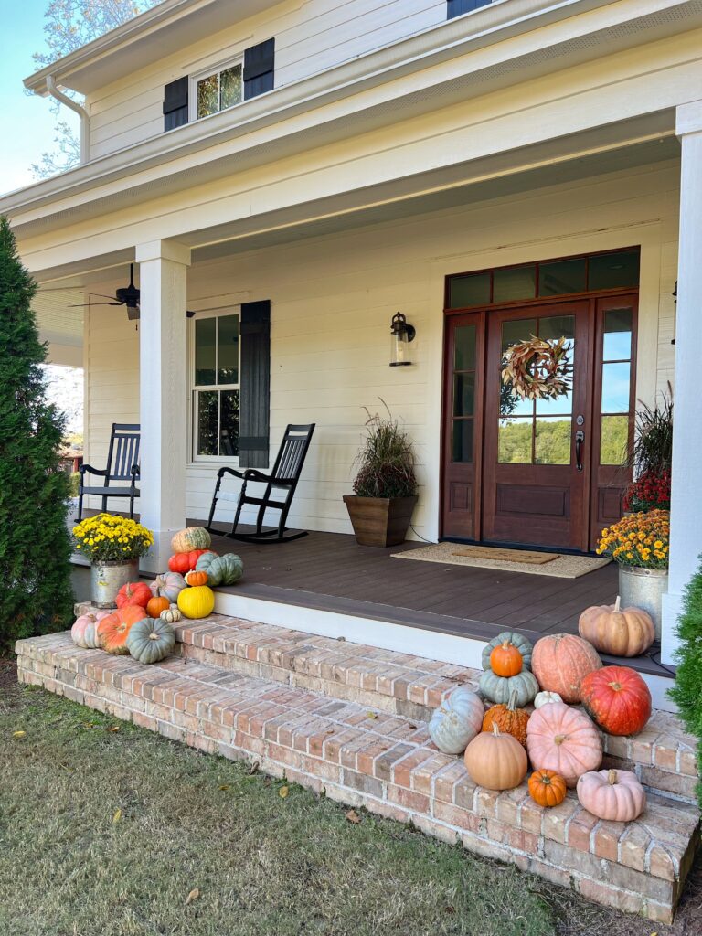 fall front porch with pumpkins